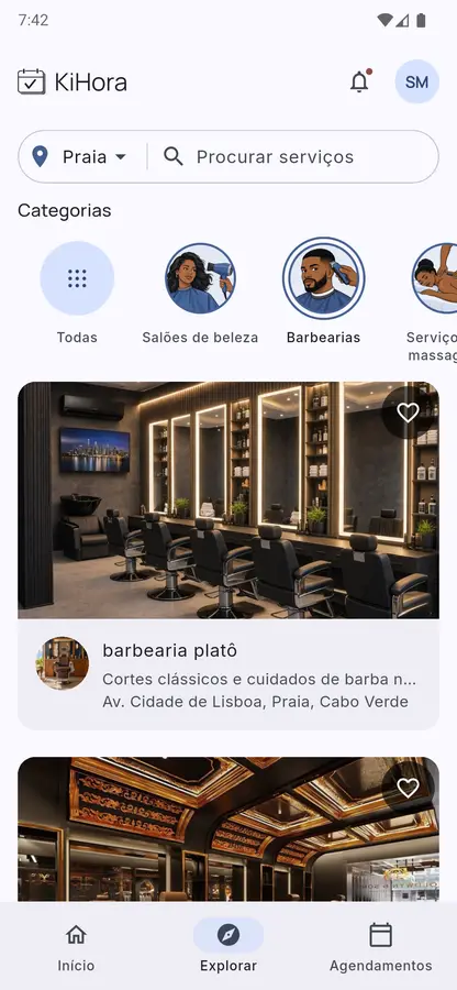 Explore in the KiHora app, showing barbershops in Praia.